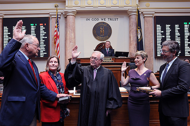 FRANKFORT, March 3 -- Two newly elected representatives were sworn in to the House. Pictured, from left, are Rep. Richard White, R-Morehead, his wife Valerie White, Chief Justice John D. Minton Jr., Rep. Rachel Roberts, D-Newport, and her husband Michael Skrzelowski.